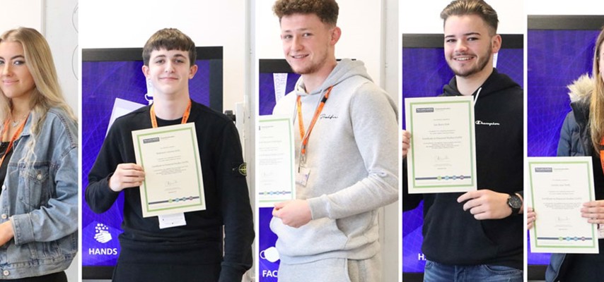 Group of students holdings certificates
