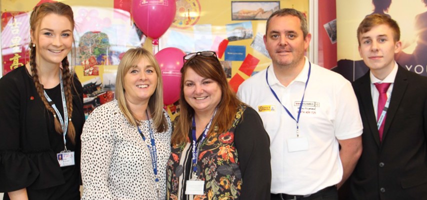 Travel and Tourism staff and Students celebrating the first year of the Travel Shop opening