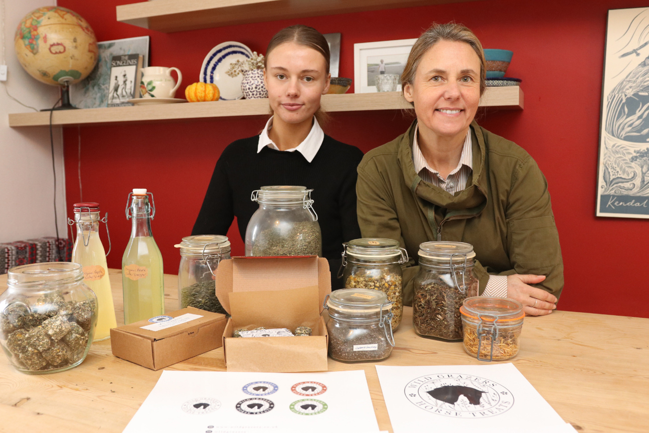 Isabel Hockenhull and Sharon Hockenhull sat in front of Wild Grazers products