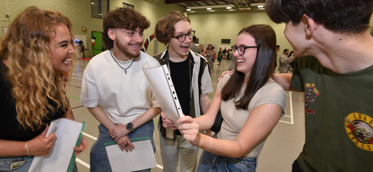 a group of students react to getting their exam results