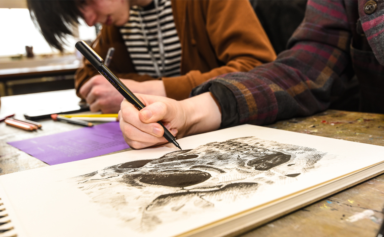 Art, Design and Media student doing practical work in the design studio