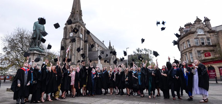 Graduates throwing their hats into the air