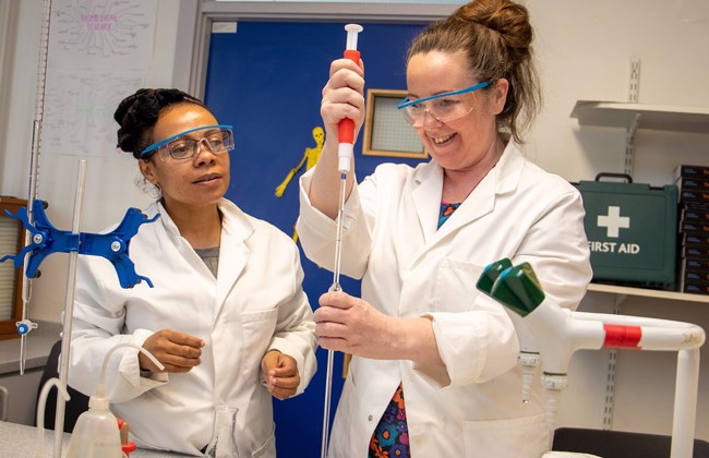 Adult students doing a science practical