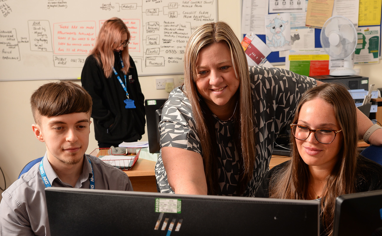 Apprentices working in an office