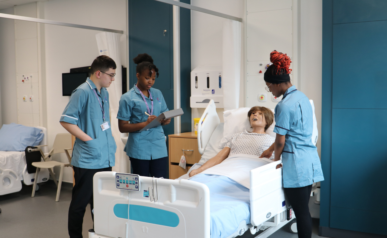 Health and Social Care students in the mock ward treating a patient