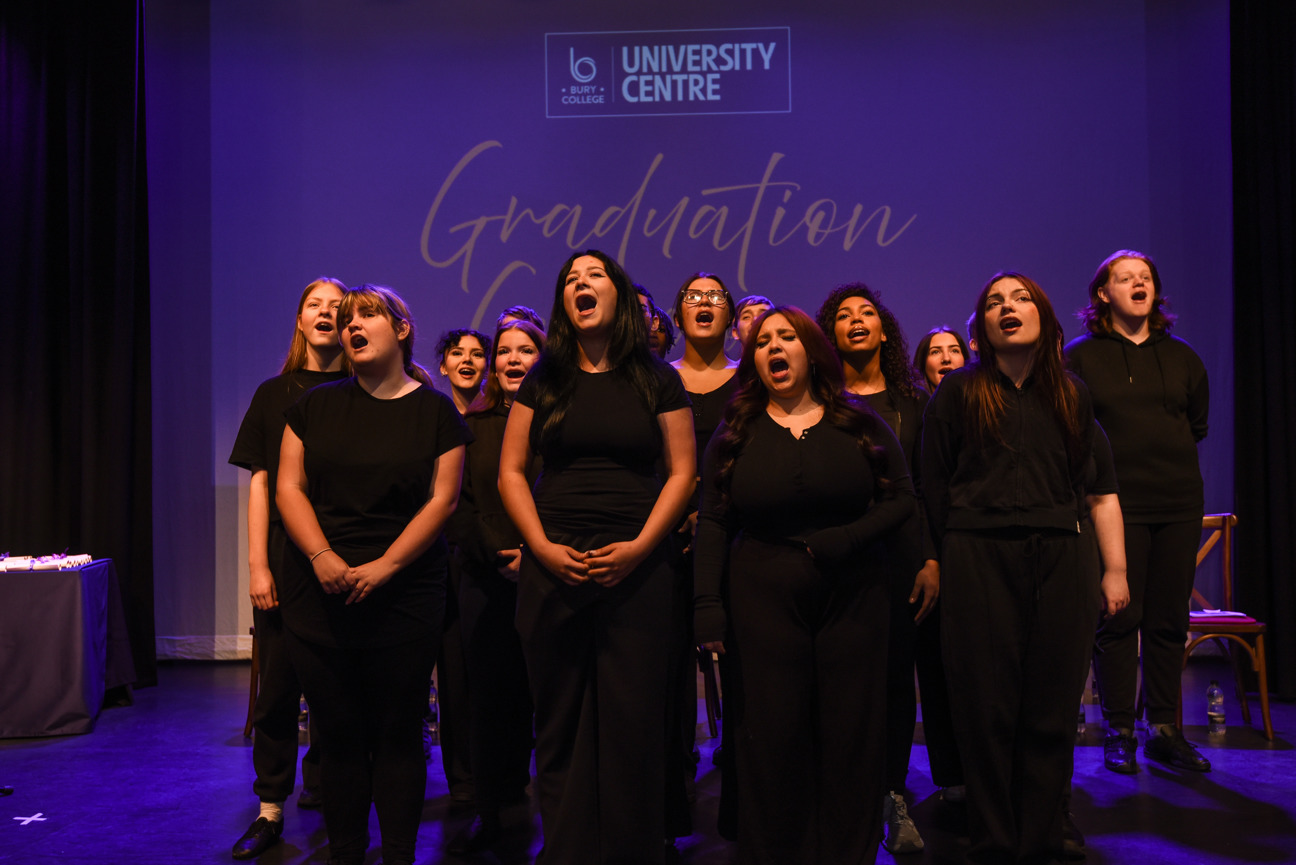 performing arts students on stage singing