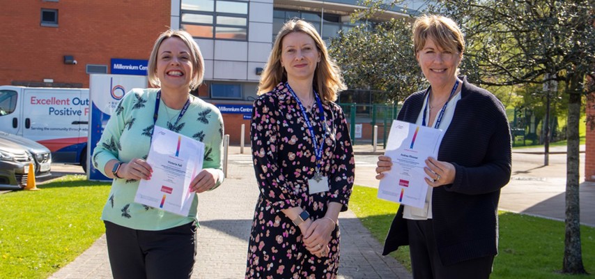 Bury College staff members holding their Education and Training Foundation Mentoring Programme certificates