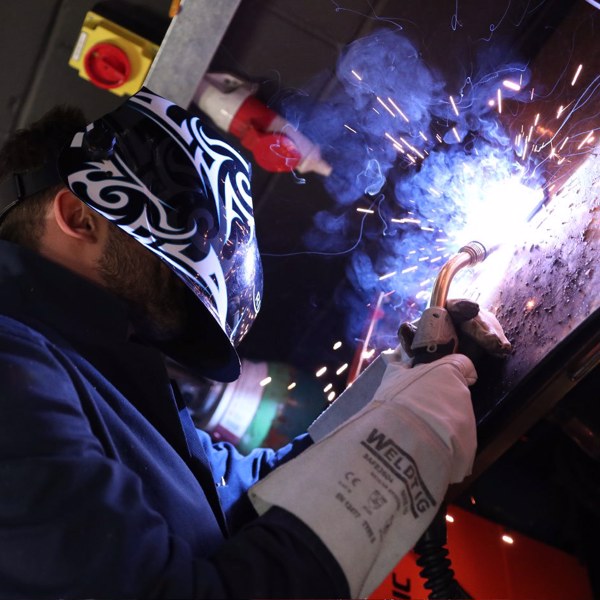 Engineer welding some metal