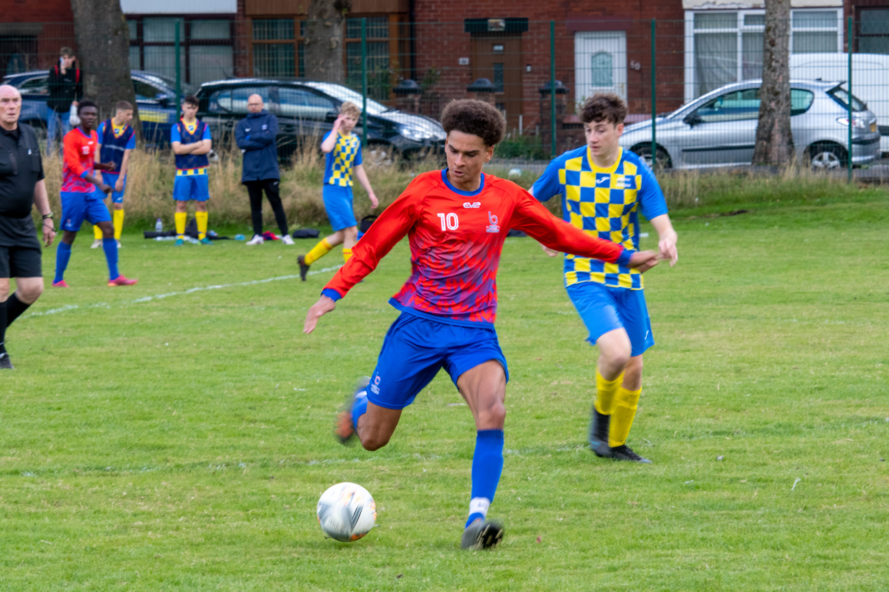 student playing football during enrichment activity