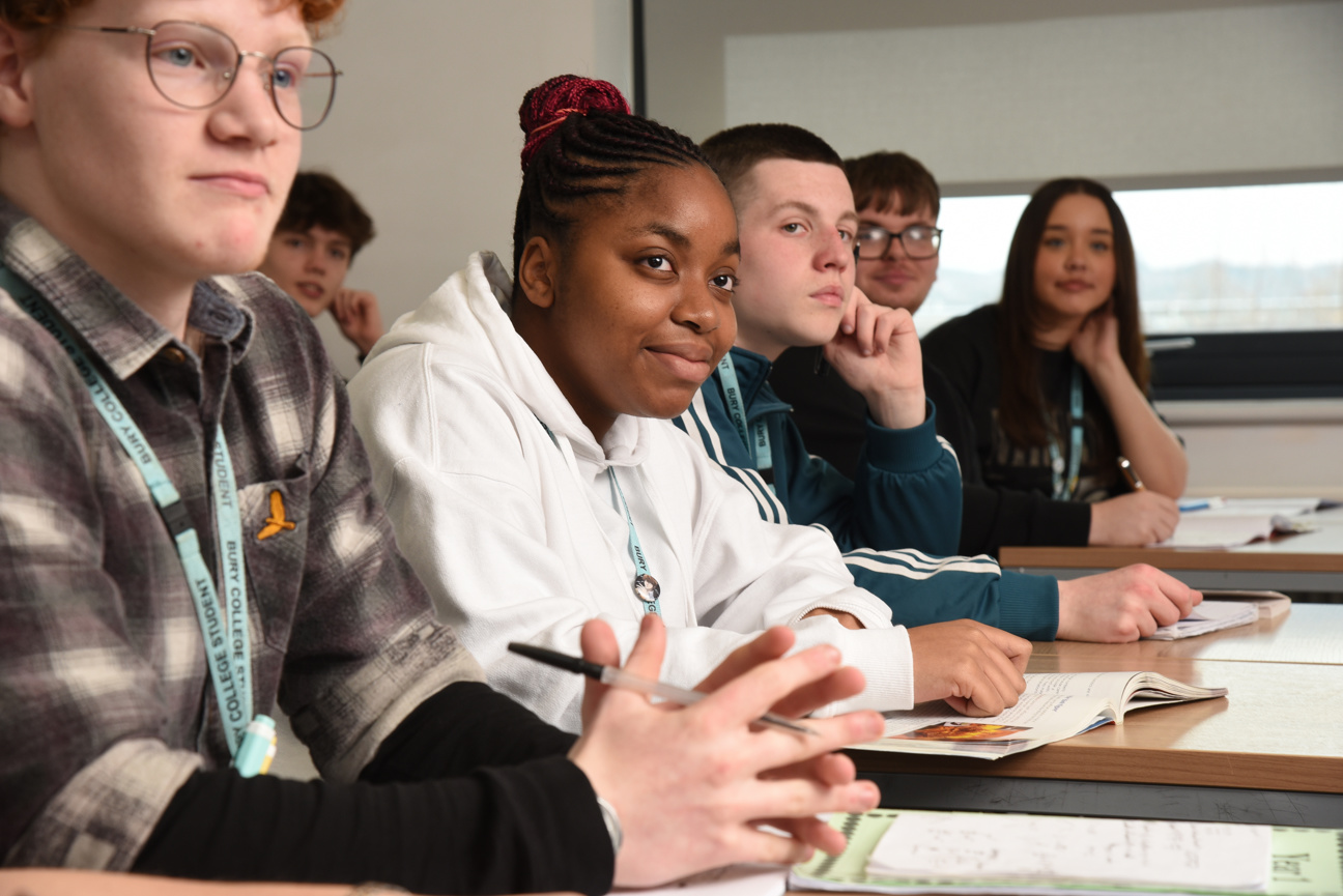 students sat in a row in a classroom