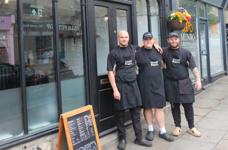 The owners and staff at Street Eats stood outside the restaurant