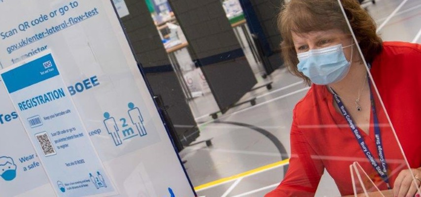 Bury College staff member at a temporary Covid testing centre