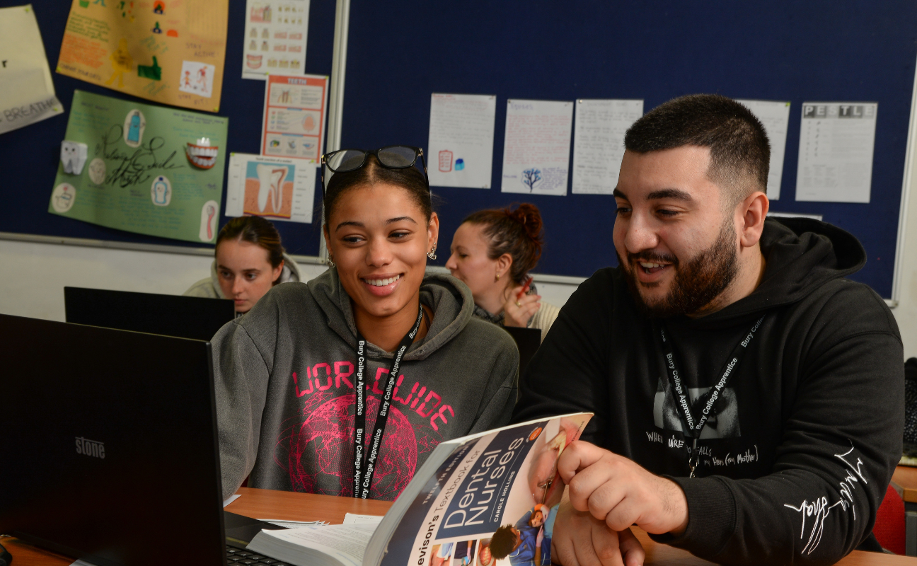 Apprentices reading in their college classroom