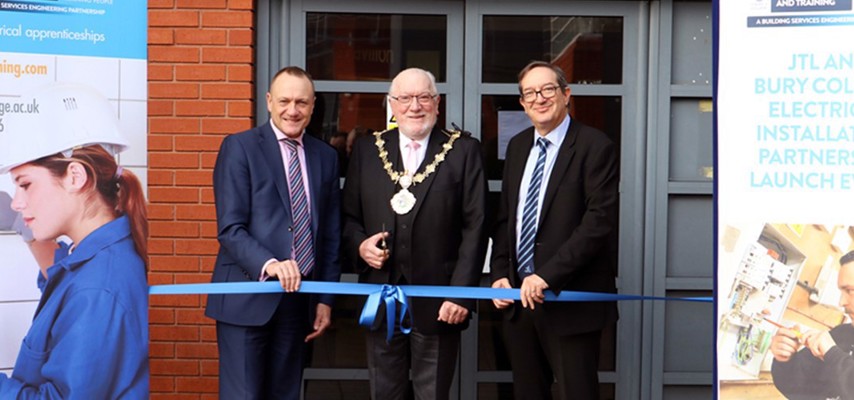 The Mayor of Bury, Councillor Trevor Holt stood with Charlie Deane and JTLs Chief Executive, Jon Graham
