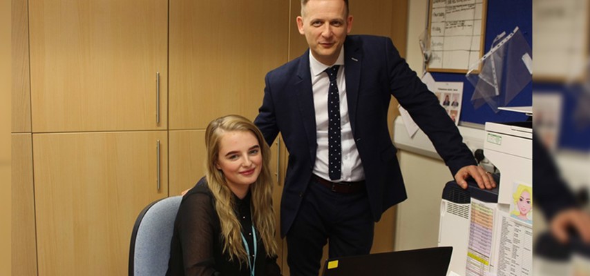Business Administration Apprentice Georgi Simms stood with Higher Lane Primary School Headteacher Mr Tetlow
