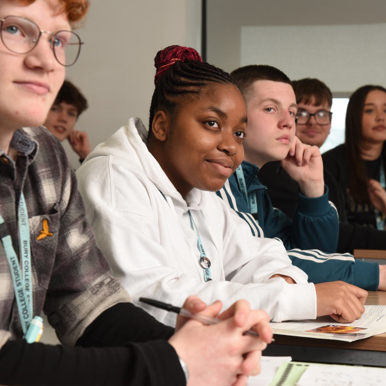 students sat in a row in a classroom