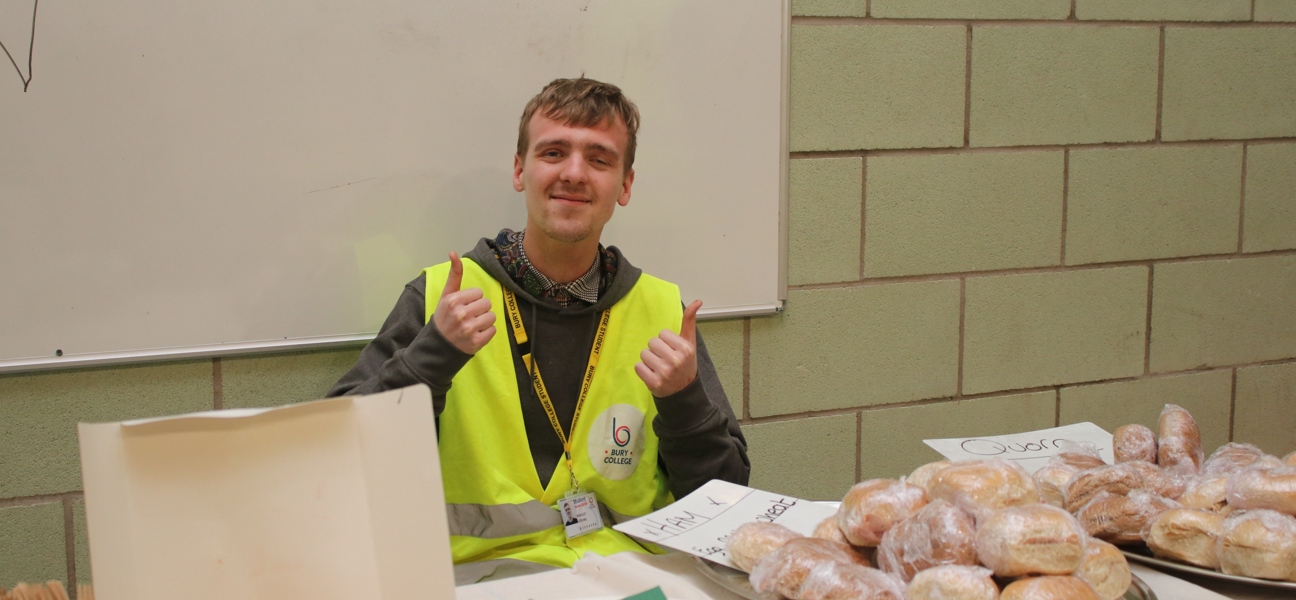 a foundation learner sat at a table with food on it