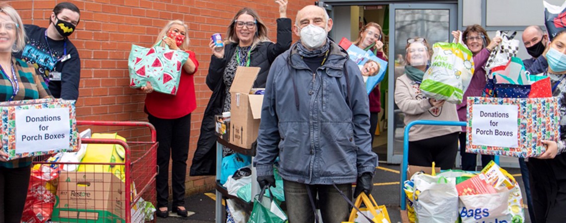Bury College Students and staff stood with donated food items and products