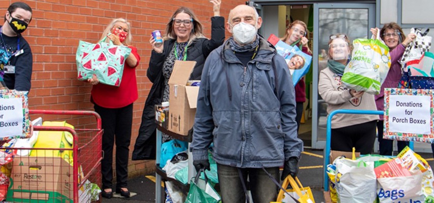 Bury College Students and staff stood with donated food items and products